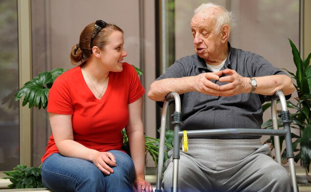 Airman 1st Class Krystal Kight, 791st Missile Security Forces Squadron convoy response force member, visits with a resident of Trinity Homes in Minot, N.D., June 28. Kight is a member of Friends of Veterans, a organization that builds relationships with veterans through active community engagement. (U.S. Air Force photo/Senior Airman Jose L. Hernandez)