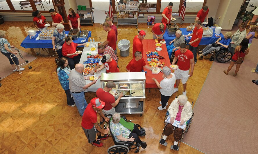 Members of Friends of Veterans volunteer organization served lunch to residents of Trinity Homes in Minot, N.D., June 28. The event is part of the group’s efforts to maintain the bond between veterans and active military members. (U.S. Air Force photo/Senior Airman Jose L. Hernandez)