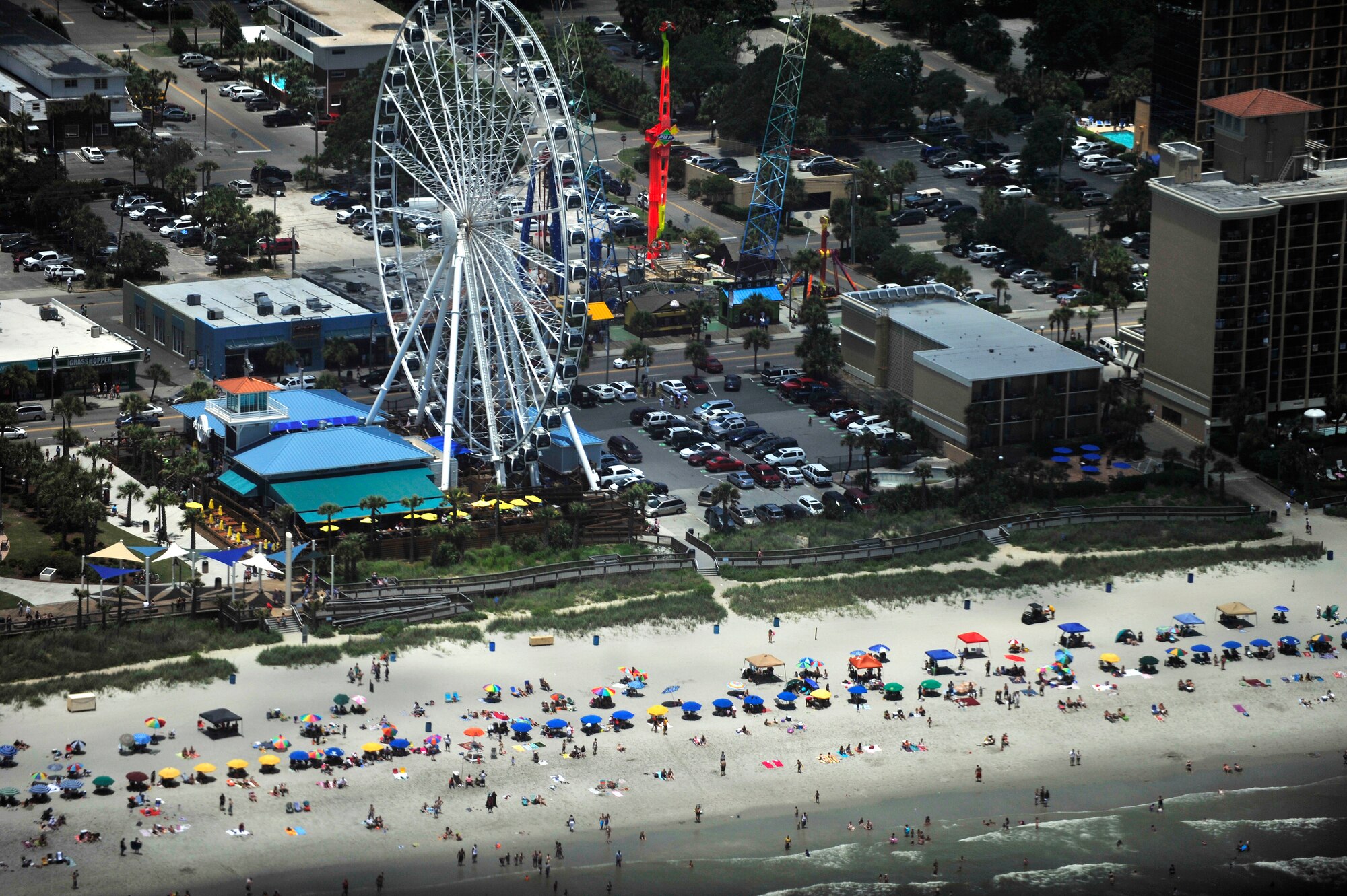 Beach goers flocked in masses to the shore on Independence Day and soaked in the sun at Myrtle Beach, S.C., July 4, 2013 The fourth annual Salute from the Shore featured nine different aircraft flying in formation along the coast of South Carolina. (U.S. Air Force Photo by Airman 1st Class Jensen Stidham/Released)