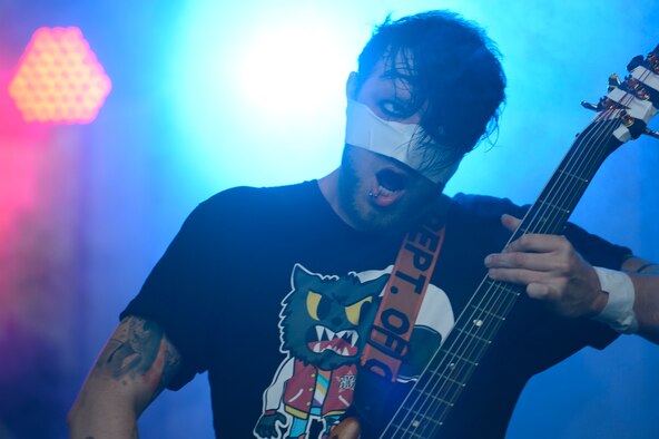 SPANGDAHLEM AIR BASE, Germany – Michael Valentine, bassist for the band Love and Deaths, plays the bass guitar during a performance July 3, 2013. Love and Death played before the headlining band Korn, warming up the audience. (U.S. Air Force photo by Staff Sgt. Christopher Ruano)