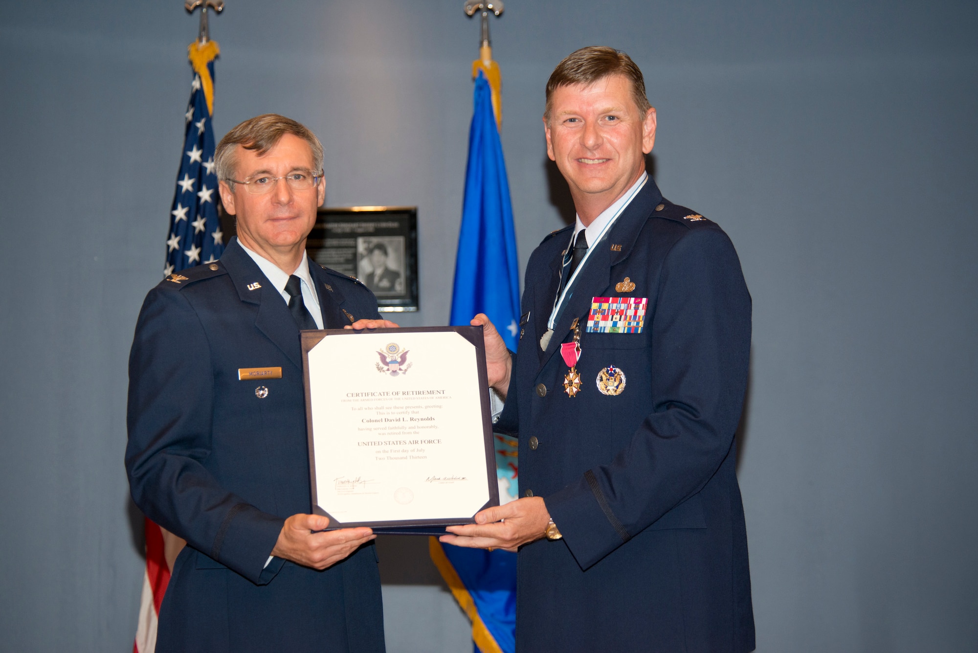 TYNDALL AIR FORCE BASE, Fla. -- After 30 years of Air Force service, Col. David
Reynolds, at right, retired June 14, 2013, as deputy director of the Air Force Civil Engineer Center, Tyndall Air Force Base, Fla. Retired Col. Robert Moriarity officiated during the ceremony. Reynolds was awarded the Legion of Merit and the 2012 U.S. Air Force and Society of American Military Engineers’ Newman Medal. (U.S. Air Force photo/Lisa Norman)