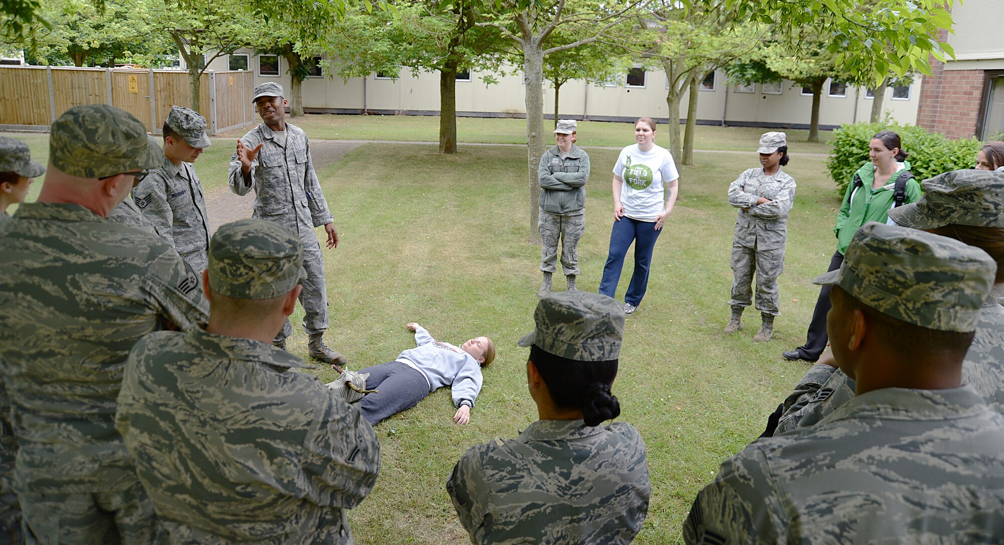 ROYAL AIR FORCE LAKENHEATH, England – Staff Sgt. Elijah Davis, 48th Aerospace Medicine Squadron, teaches a self-aid and buddy care class during medical field training July 2, 2013. Public health, independent medical technician and bioenvironmental engineering Airmen trained in tandem as their deployed duties routinely overlap in emergency situations. Each section showcased a few of their specialties including patient care, air and water sampling, and disease-prevention measures. (U.S. Air Force photo by Staff Sgt. Thomas Trower)