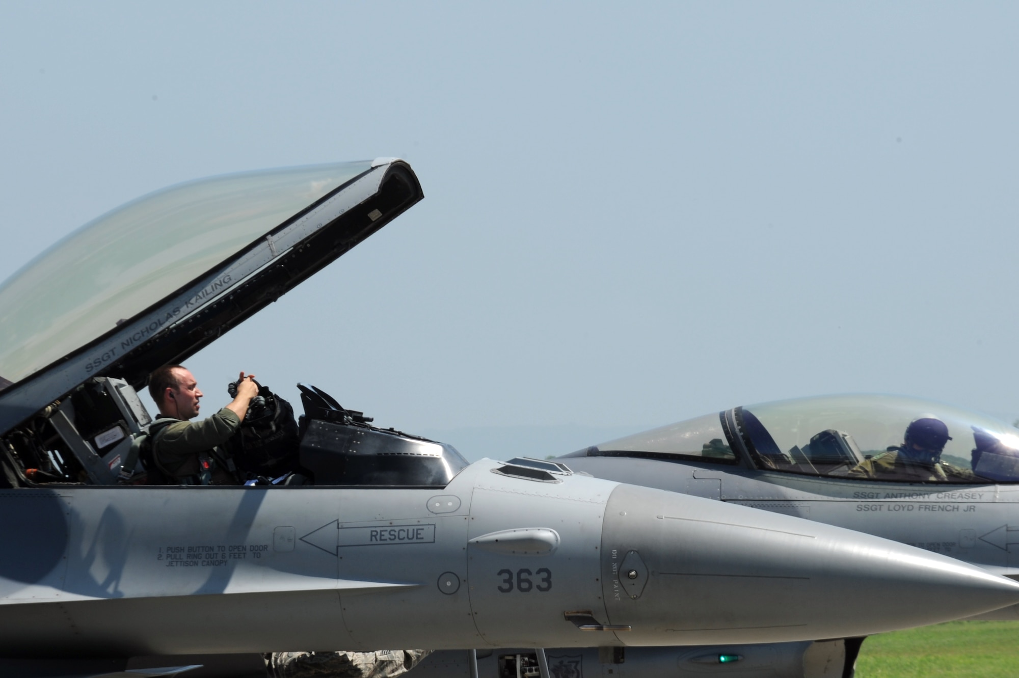 Maj. Jason Mascetta, 13th Fighter Squadron assistant director of operations, prepares to exit a U.S. Air Force F-16 Fighting Falcon on the flight line at Chitose Air Base, Japan, July 8, 2013. Mascetta is the detachment commander and was the first pilot to complete training for the Aviation Training Relocation mission that worked hand-in-hand with the Japan Air Self-Defense Force in air-to-air simulated combat. (U.S. Air Force photo/Senior Airman Derek VanHorn)