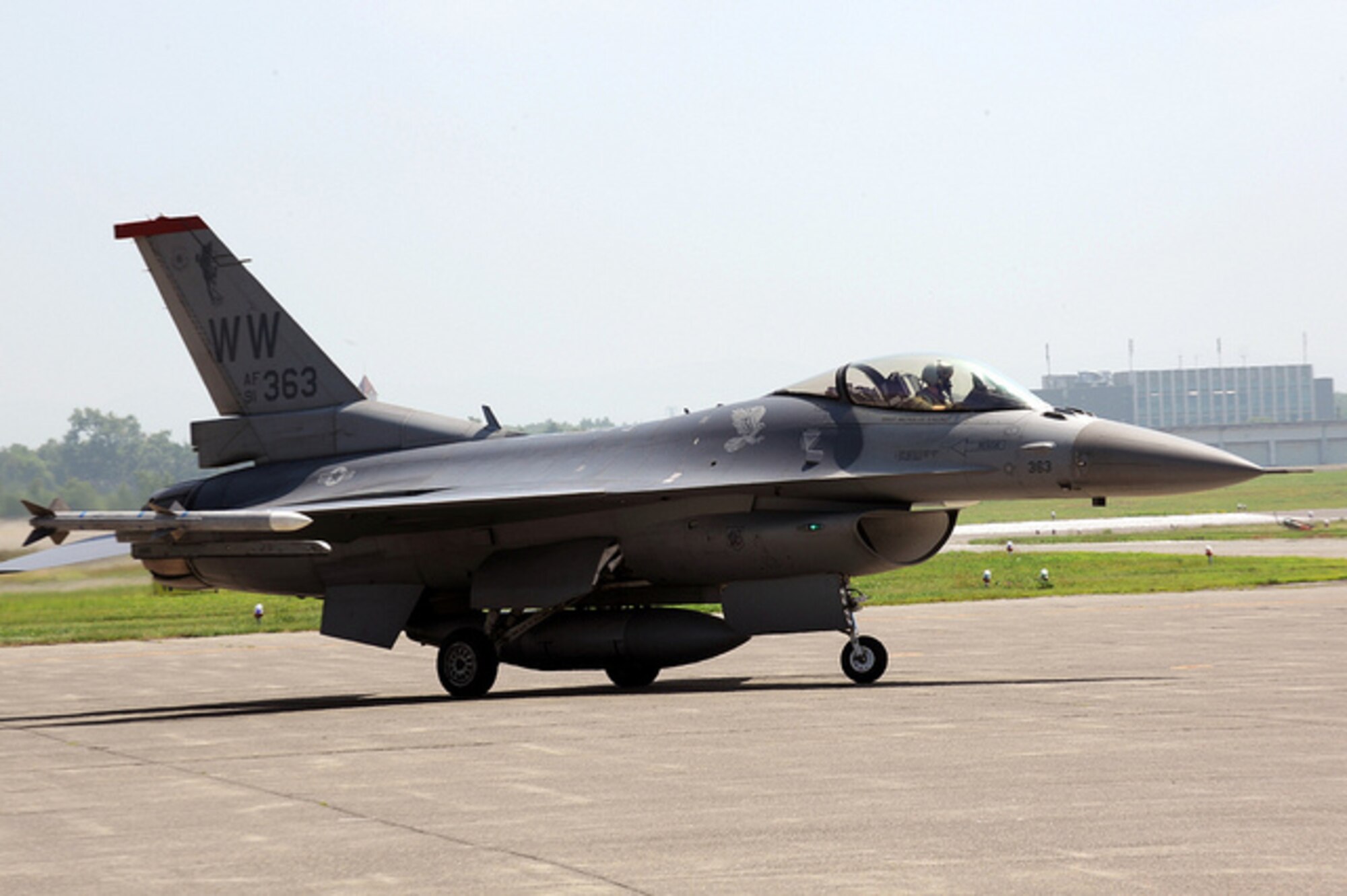 Maj. Jason Mascetta, 13th Fighter Squadron assistant director of operations, taxis a U.S. Air Force F-16 Fighting Falcon around the runway at Chitose Air Base, Japan, July 8, 2013. Mascetta is the detachment commander for the Aviation Training Relocation mission that worked hand-in-hand with the Japan Air Self-Defense Force in air-to-air simulated combat. (U.S. Air Force photo/Senior Airman Derek VanHorn) 