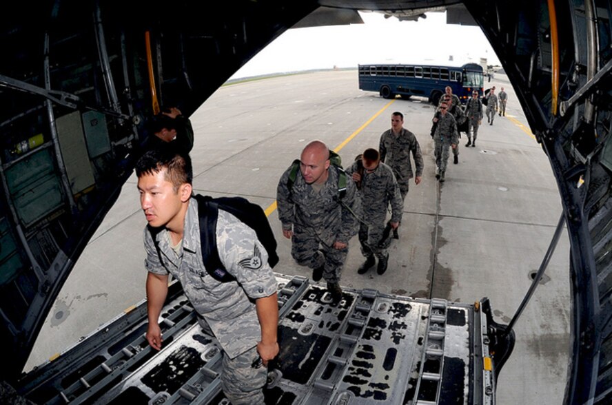 Airmen from Misawa Air Base, Japan, board a C-130 Hercules July 7, 2013, bound for an Aviation Training Relocation mission at Chitose, AB, Japan. Nearly 100 Airmen traveled to Japan’s northernmost island to conduct jet pilot training between the U.S. Air Force and the Japan Air Self-Defense Force. (U.S. Air Force photo/Senior Airman Derek VanHorn) 