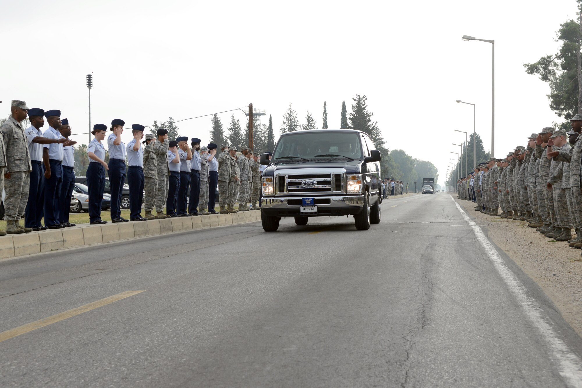 Airmen from the 39th Air Base Wing line up to render a final salute to outgoing commander, Col. Chris Craige, before the wing’s change of command ceremony July 9, 2013, at Incirlik Air Base, Turkey. Craige passed command of the 39th ABW to Col. Craig Wills. (U.S. Air Force photo by Tech. Sgt. Dallas Edwards/Released)