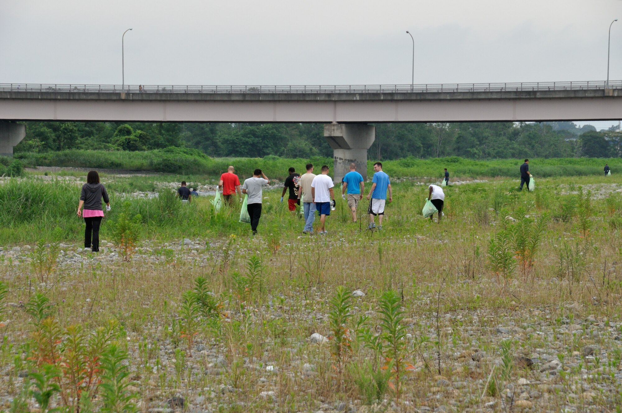 FUSSA, Japan -- Members of the 374th Logistics Readiness Squadron Vehicle
Management Flight pick up garbage at the Minami Koen park in Fussa, Japan,
July 3, 2013. The flight decided to Adopt-A-Park in Japan similar to the
Adopt-A-Highway program in the United States. (Courtesy photo by Yuichi
Yano)
