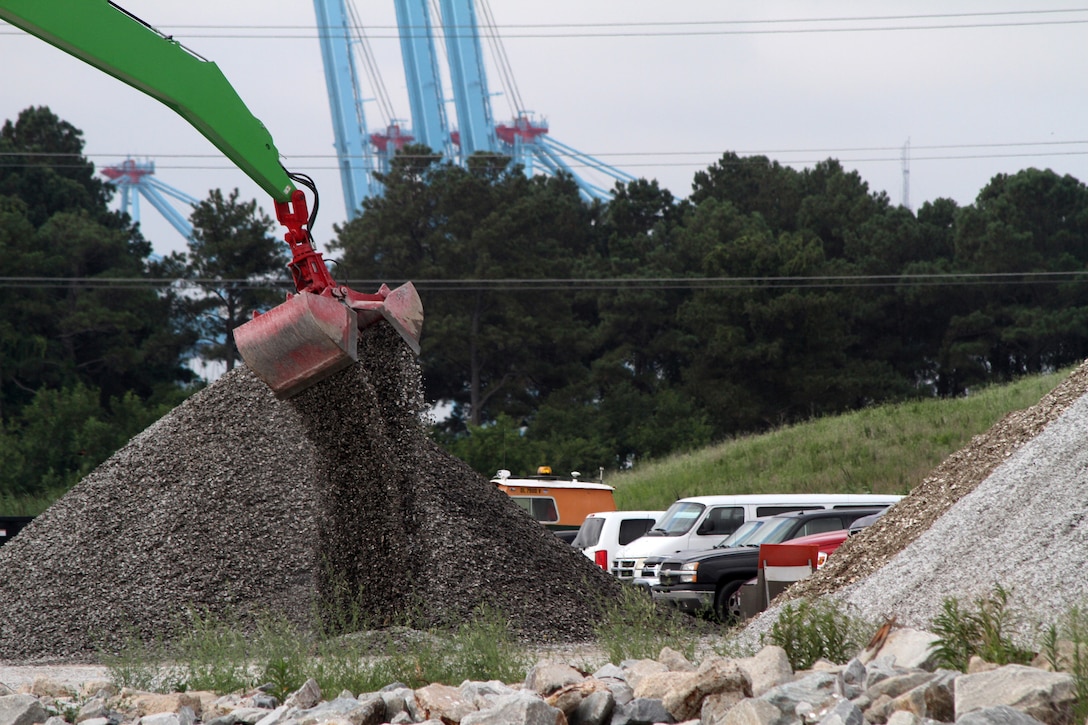 PORTSMOUTH, Va. – Cranes at the Craney Island Dredged Material Management Area, or CIDMMA, here are removing fossil shell from a barge. This will be a temporary home for thousands of cubic yards of fossil shell that has been dredged from Tribell Shoal in the James River. On July 8, the site began storing the shell, which will be used for the construction of six oyster reefs for the Craney Island Eastward Expansion project. Construction of the $3.6 million environmental restoration project is set to begin in August of this year. Reefs will be built in Hoffler Creek, Baines Creek, Blows Creek, the Lafayette River and two in Gilligan’s Creek.