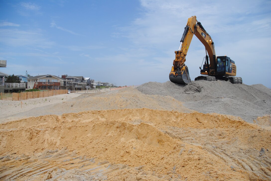 As part of a U.S. Army Corps of Engineers effort, a contractor places sand on an existing coastal storm risk reduction project on Long Beach Island, NJ, that was severely impacted by Hurricane Sandy. The Corps' Philadelphia District is managing the project. In total, more than 26 million cubic yards of sand will be placed along the coastline throughout the northeastern United States to restore coastal storm risk reduction projects previously built by the Corps. The bulk of the sand, roughly 23 million cubic yards, will be placed in New York and New Jersey.