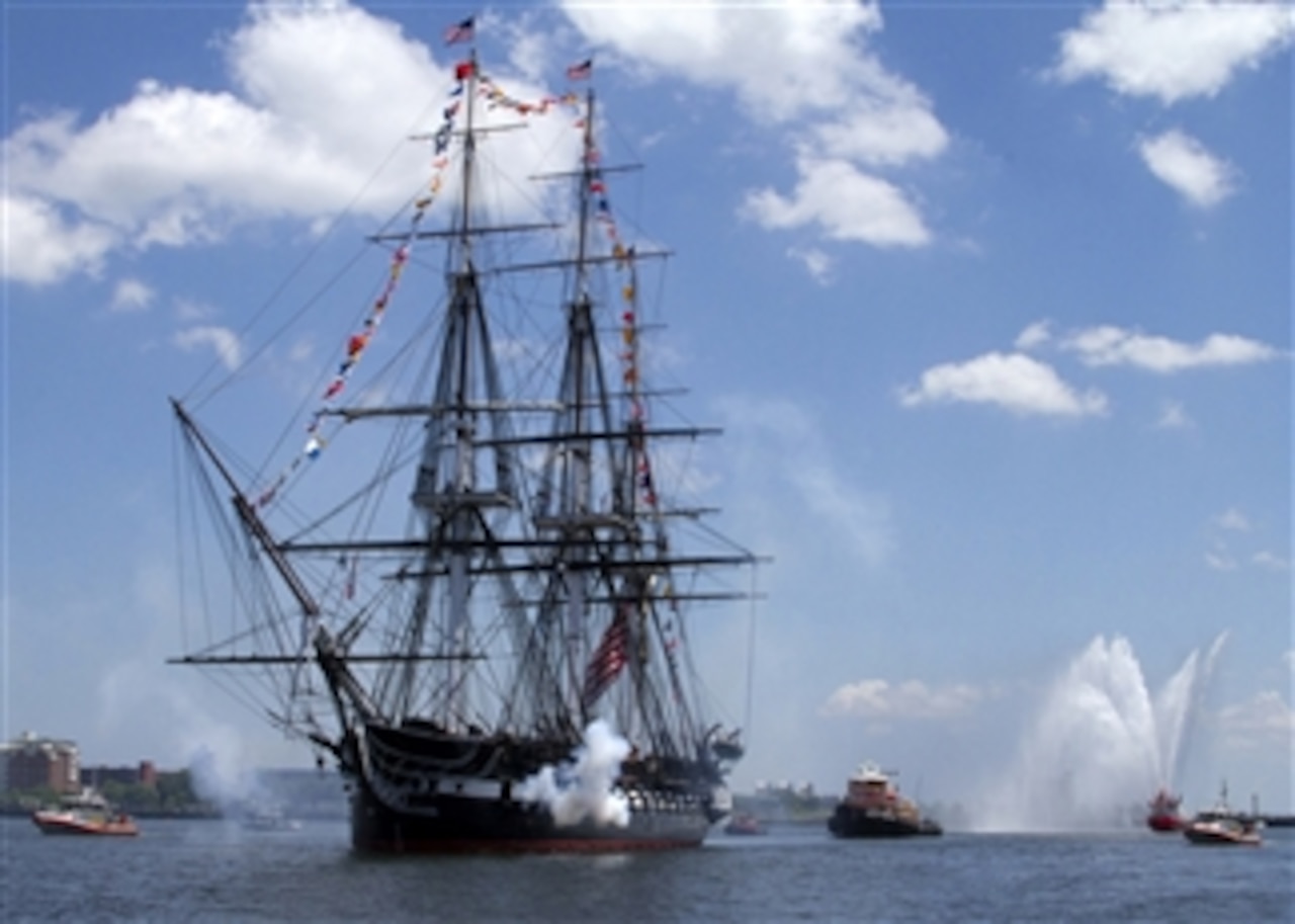 The USS Constitution fires a 21-gun salute in honor of America's 237th birthday during the ship's annual Fourth of July turnaround cruise in Boston Harbor on July 4, 2013.  More than 500 guests got underway with Old Ironsides for a three-hour tour of Boston Harbor in celebration of Independence Day.  