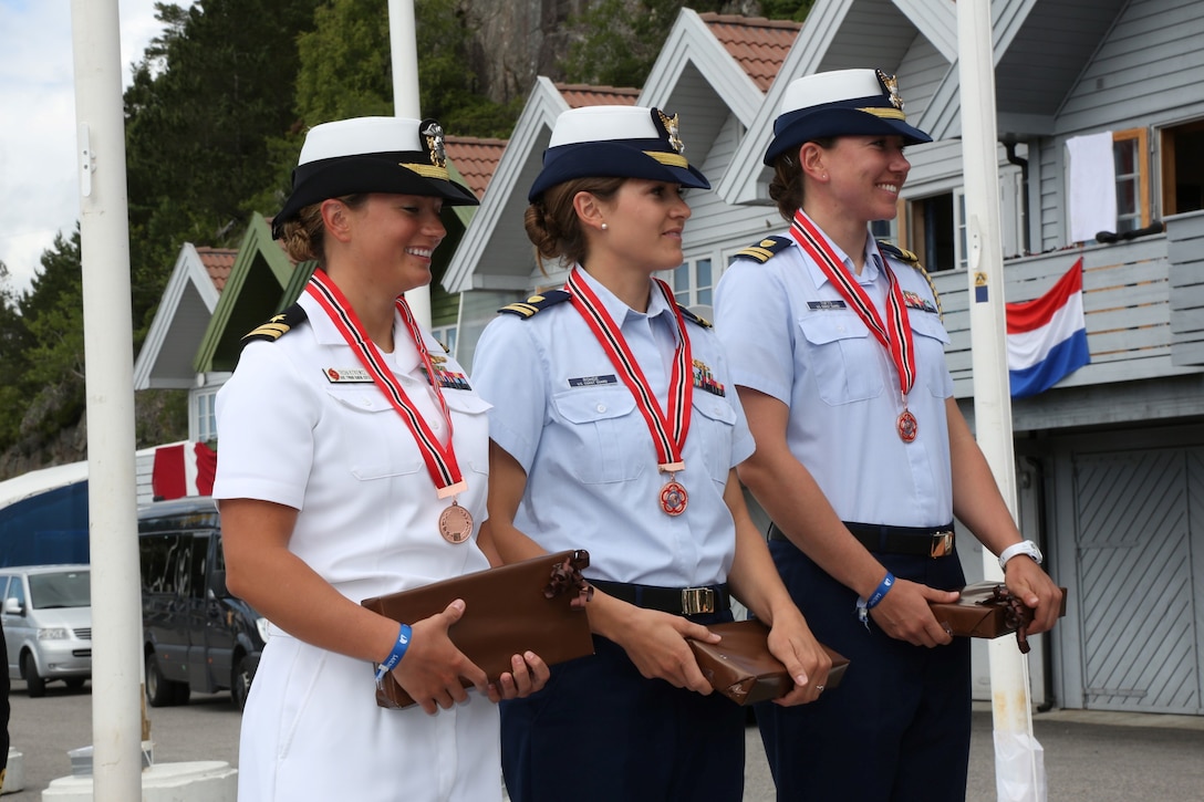 Navy LTJG Trisha Kutkiewicz, Coast Guard LTJG Krysta Rohde and Coast Guard LT Elizabeth Tufts of the US Armed Forces Womens Sailing Team win the bronze medal of the CISM World Sailing Military Championship in Bergen, Norway 27 June to 4 July 2013.  