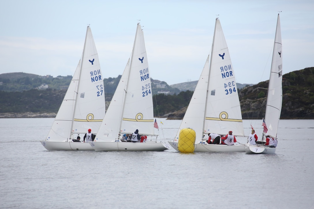 Competitors rounding the point at the 2013 CISM Sailing World Military Championship in Bergen, Norway 27 June to 4 July.