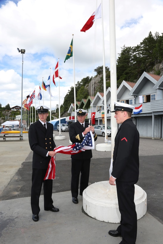 Sailors of the Norwegian Navy prepare to raise the US Flag during the awards ceremony of the 2013 CISM Sailing World Military Championship in Bergen, Norway 27 June to 4 July.  Team USA Women won the bronze medal led by Skipper Navy LTJG Trisha Kutkiewicz	 with Coast Guard LTJG Krysta Rohde and Coast Guard LT Elizabeth Tufts.
