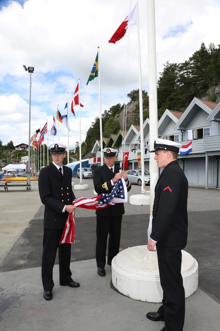 Sailors of the Norwegian Navy prepare to raise the US Flag during the awards ceremony of the 2013 CISM Sailing World Military Championship in Bergen, Norway 27 June to 4 July. Team USA Women won the bronze medal led by Skipper Navy LT Trisha Kutkiewicz with Coast Guard LTJG Krysta Rohde and Coast Guard LT Elizabeth Tufts.