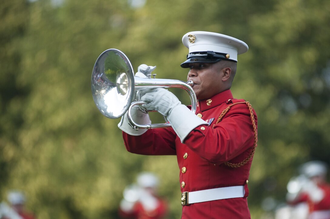 A U.S. Marine Drum & Bugle Corps bugler, performs during a Tuesday Sunset Parade at the Marine Corps War Memorial in Arlington, Va., July 9.