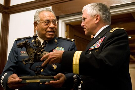 Chief of Staff of the Army, Gen. George W. Casey Jr., gives Gen. Guillermo Galvan, Secretary of Mexico's National Defense, a Remington Statue as part of a gift exchange and at the conclusion of their meeting in Mexico City, Mexico, Aug. 4, 2010.   Army photo by D. Myles Cullen (released)  