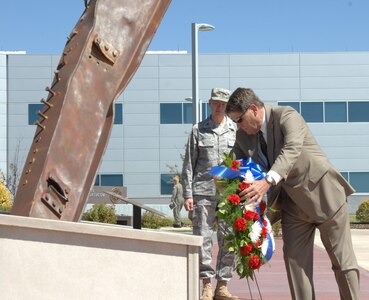 Don Addy, president and CEO of the National Homeland Defense Foundation, lays a wreath at the North American Aerospace Defense Command and U.S. Northern Command headquarters 9-11 memorial during a memorial service Sept. 10, 2010. 

