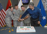 Air Force Staff Sgt. Jessica Yetzke, Army Maj. Glen Keith, U.S. Northern Command Chief of Staff Air Force Maj. Gen. Howard Thompson and Lawrence Reyes, cut the U.S. NORTHCOM birthday cake during a celebration at the North American Aerospace Defense Command and USNORTHCOM headquarters Oct. 1. The command stood up on Oct. 1, 2002, in response to the Sept. 11, 2001, terrorist attacks. In conjunction with the activation, Joint Forces Headquarters Homeland Security, Joint Task Force Civil Support, Joint Task Force 6, and the Joint Regional Medical Planning Program were transferred from U.S. Joint Forces Command to USNORTHCOM. 


