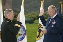 Chief of the National Guard Bureau, U.S. Air Force General Craig R. McKinley, administers the oath of service to U.S. Army Lt. Gen. Frank J. Grass at a promotion ceremony honoring Lt. Gen. Grass at Garden of the Gods Club in Colorado Springs 6 p.m. Sunday. Upon receiving his third star Lt. Gen. Grass, U.S. Northern Command operations officer since Sept. 2008, assumes the position of deputy commander USNORTHCOM. 


