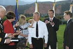 Wife Pat and son Patrick watch as son Joe, daughter Laura Fisher and granddaughter Sophia attach the three star epaulettes to the shoulders of Lt. Gen. Frank J. Grass at a promotion ceremony honoring Lt. Gen. Grass at Garden of the Gods Club in Colorado Springs 6 p.m. Sunday. Upon receiving his third star Lt. Gen. Grass, U.S. Northern Command operations officer since Sept. 2008, assumes the position of deputy commander USNORTHCOM. 

