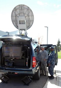 Air Force Lt. Col. Joseph Kopacz receives a tour of the U.S. Northern Command Standing Joint Force Headquarters' new Emergency Response Vehicle from Navy Chief Petty Officer Christopher Davis, NC-SJFHQ communications specialist during an open display of the vehicle Oct. 5. The customized 2010 Chevrolet Suburban sports an advanced communications package that provides the NC-SJFHQ with phone communications, secured computer networks, commercial internet and video teleconferencing in a mobile package small enough to be transported by a C-130. 

