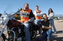 Scott Fleming, owner of Scott's Mobile Motorcycle Service, uses Coast Guard Petty Officer 1st Class Troy Thomas's 2000 Harley Davidson Softtail Deuce to teach more than 30 members of the North American Aerospace Defense Command and U.S. Northern Command the proper way to conduct a pre-ride motorcylcle inspection Sept. 24. More than 70 people attended the NORAD and USNORTHCOM Motorcyle Safety Day class, which went over the military regulations pertaining to motorcycles, the proper protective equipment and safety guidelines. After the class, about half the attendees participated in the 110-mile safety ride and Most Desirable Bike contest. The Safety Day kicks off the NORAD and USNORTHCOM Motorcycle Mentorship Program. 

