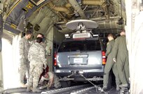 Air crew and loadmasters with the 302nd Air Mobility Wing and members of the U.S. Northern Command Standing Joint Force Headquarters observe closely as the SJFHQ’s Emergency Response Vehicle is loaded onto a C-130 cargo plane for the first time. USNORTHCOM SJFHQ’s mission is to provide Commander, USNORTHCOM with the scalable capability to form the core of a Joint Task Force or to augment multiple organizations in order to anticipate and conduct Homeland Defense and Civil Support missions anywhere in the USNORTHCOM Area of Responsibility during planned or crisis operations. 

