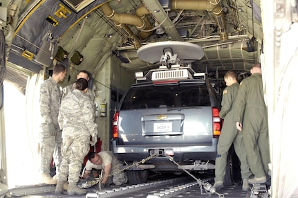 Air crew and loadmasters with the 302nd Air Mobility Wing and members of the U.S. Northern Command Standing Joint Force Headquarters observe closely as the SJFHQ’s Emergency Response Vehicle is loaded onto a C-130 cargo plane for the first time. USNORTHCOM SJFHQ’s mission is to provide Commander, USNORTHCOM with the scalable capability to form the core of a Joint Task Force or to augment multiple organizations in order to anticipate and conduct Homeland Defense and Civil Support missions anywhere in the USNORTHCOM Area of Responsibility during planned or crisis operations. 

