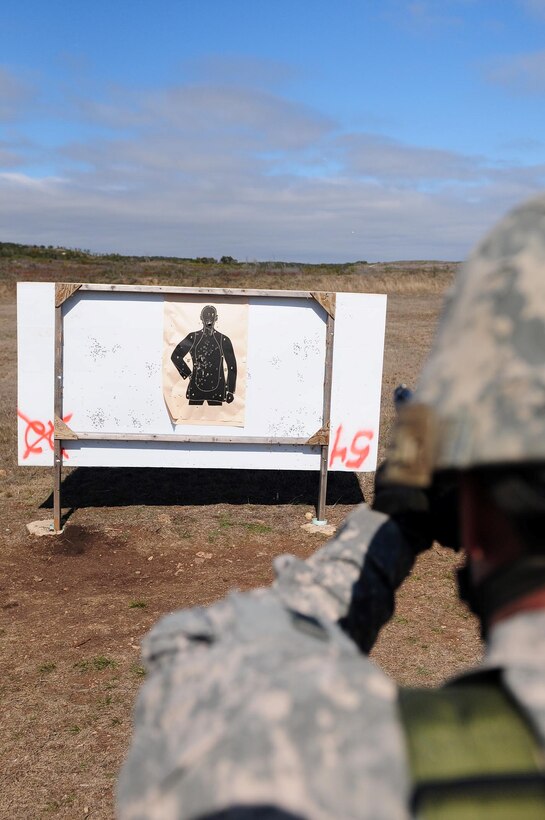 A U.S. Army North Soldier fires an M-9 Berretta Pistol during advanced marksmanship training conducted by Army North’s Headquarters Support Company Jan. 20 at the Camp Bullis Military Training Reservation in San Antonio. 
