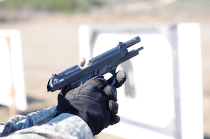 Sgt. 1st Class Antonio Turberville, operations noncommissioned officer, Headquarters Support Company, Army North, fires an M-9 Berretta Pistol Jan. 20 during advanced marksmanship training at the Camp Bullis Military Training Reservation in San Antonio. 
