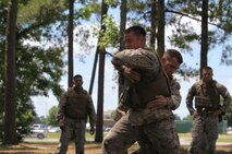 Marines with 8th Engineer Support Battalion, 2nd Marine Logistics Group practice body throws during a Marine Corps Martial Arts Program instructor course aboard Camp Lejeune, N.C., May 22, 2013. The Marines trained to become martial arts instructors and teach MCMAP techniques, which incorporated multiple forms of martial arts such as karate, Judo, and Jujutsu. 