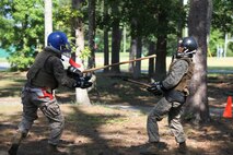 A Marine dodges a strike aimed at his head during a Marine Corps Martial Arts Program instructor course held for Marines with 8th Engineer Support Battalion, 2nd Marine Logistics Group and 10th Marine Regiment, 2nd Marine Division aboard Camp Lejeune, N.C., May 28, 2013. The service members trained with a number of fighting styles, which included bayonet fighting, using weapons of opportunity and ground fighting. 