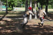 Cpl. Andrew R. Santander (left), an engineering equipment operator with 10th Marine Regiment, 2nd Marine Division attacks a Marine with 8th Engineer Support Battalion, 2nd Marine Logistics Group from behind during a Marine Corps Martial Arts Program instructor course aboard Camp Lejeune, N.C., May 28, 2013. MCMAP was designed to enhance the Marine Corps’ capabilities as an elite fighting force, provide combat skills for all Marines and strengthen the Marine Corps warrior ethos.