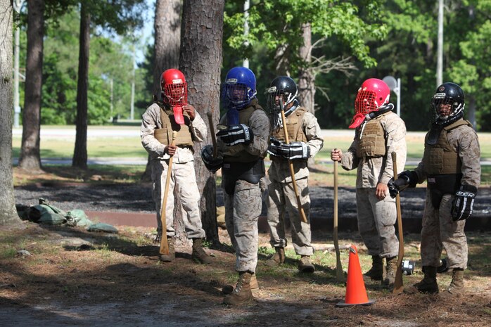 Marines with 8th Engineer Support Battalion, 2nd Marine Logistics Group and 10th Marine Regiment, 2nd Marine Division wait for a chance to practice fighting each other during a Marine Corps Martial Arts Program instructor course aboard Camp Lejeune, N.C., May 22, 2013. The Marines underwent a 15-day training program, which integrated physical, mental, and character disciplines into a close combat system. 