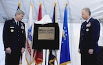 Air Force Chief of Staff Gen. Norton A. Schwartz and Air Force Col. Robert Edmondson, commander of the Air Force Mortuary Affairs Operations Center, read the inscription on the plaque they unveiled during a dedication ceremony for the Center for Families of the Fallen at Dover Air Force Base, Del., Jan. 6, 2010.