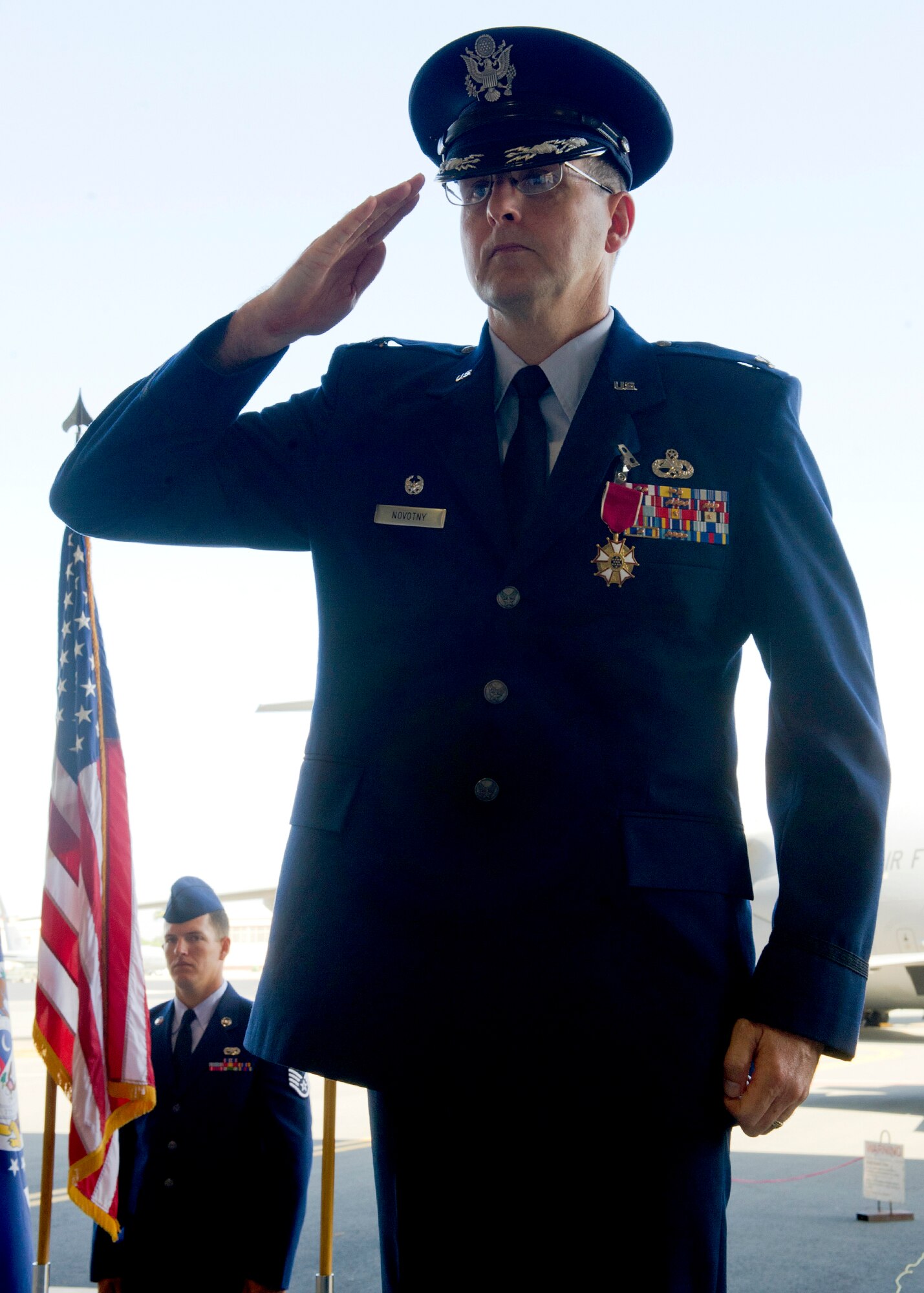 Col. Michael Novotny, outgoing 15th Maintenance Group commander, renders his last salute to the 15 MXG Airmen prior to relinquishing command to Col. David Pastore, the incoming 15th MXG commander during a ceremony at Hangar 19 on Joint Base Pearl Harbor-Hickam, Hawaii, July 9, 2013. Novotny is headed to Warner Robbins, Headquarters Air Force Reserve Command, where he will be the Logistics Operations Division Chief. (U.S. Air Force photo/Tech. Sgt. Jerome S. Tayborn)