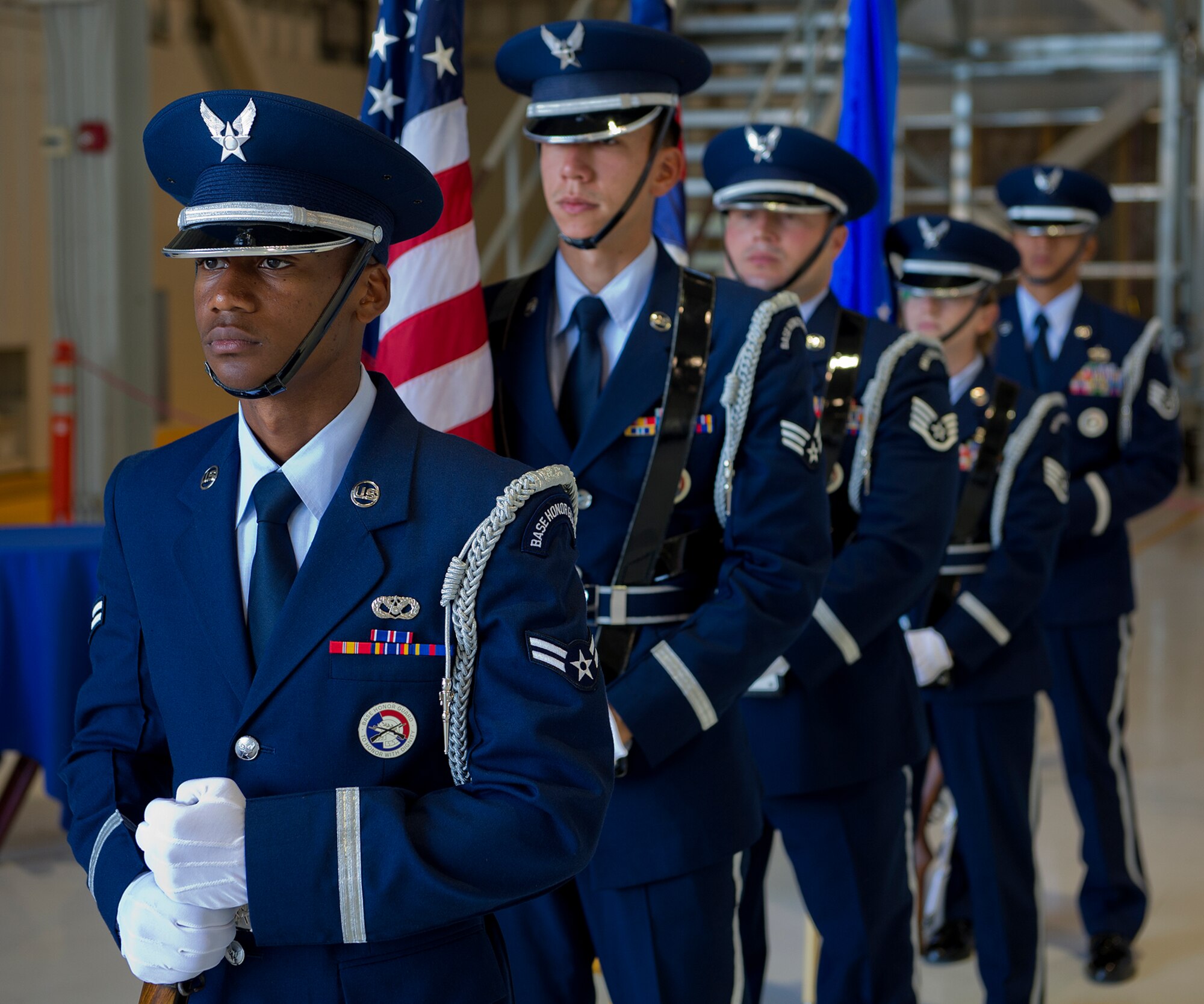 Members of the 15th Wing Honor Guard stand at parade rest prior to the 15th Maintenance Group change of command ceremony at Hangar 19 on Joint Base Pearl Harbor-Hickam, Hawaii, July 9, 2013. During the ceremony, Col. Michael Novotny relinquished command to Col. David Pastore. (U.S. Air Force photo/Tech. Sgt. Jerome S. Tayborn)