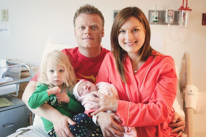 The Potter family poses just hours after their baby was born May 6, 2013. Without any preparation Staff Sgt. Talon Potter, 799th Security Forces Squadron security forces leader, delivered his daughter Ella Rose Potter at home while following directions from a 911 dispatcher. (Photo by Danica Michelle Photography)