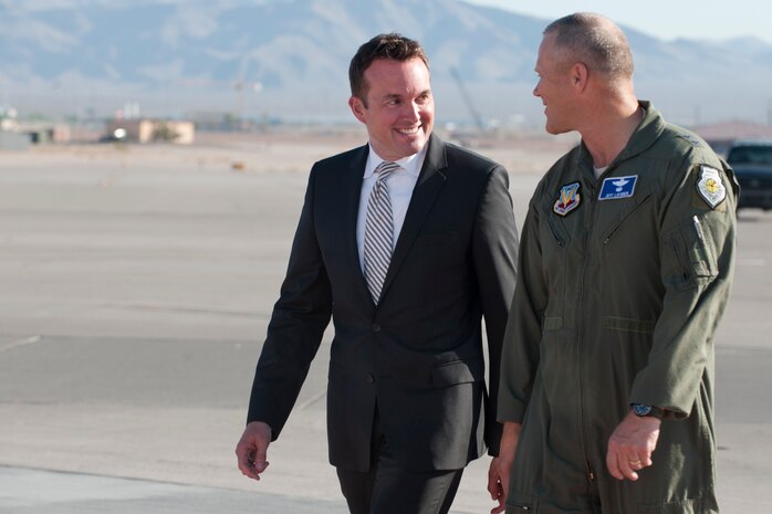 Acting Secretary of the Air Force Eric Fanning is greeted by Maj. Gen.  Jeffrey Lofgren, commander, U.S. Air Force Warfare Center, July 8, 2013, at Nellis Air Force Base, Nev. Fanning’s tour of Nellis was his first as the acting secretary, he received mission briefings on Red Flag, U.S. A.F. Weapons School and the F-35 mission.  (U.S. Air Force Photo by Lawrence Crespo)
