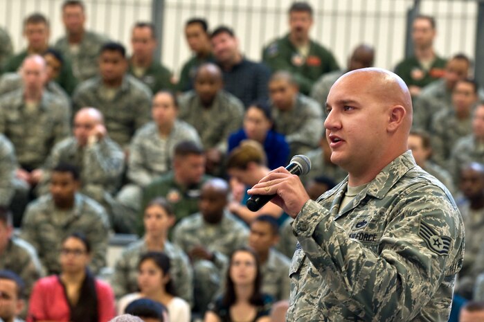 Staff Sgt. Micah Bushardt, 757th Aircraft Maintenance Squadron crew chief, asks Acting Secretary of the Air Force Eric Fanning a question during the Acting SecAF All Call at Flanker Aircraft Maintenance Unit's hangar July 8, 2013, at Nellis Air Force Base, Nev. After Fanning spoke, the floor was open for Airmen to voice their questions and concerns. (U.S. Air Force photo by Senior Airman Matthew Lancaster)