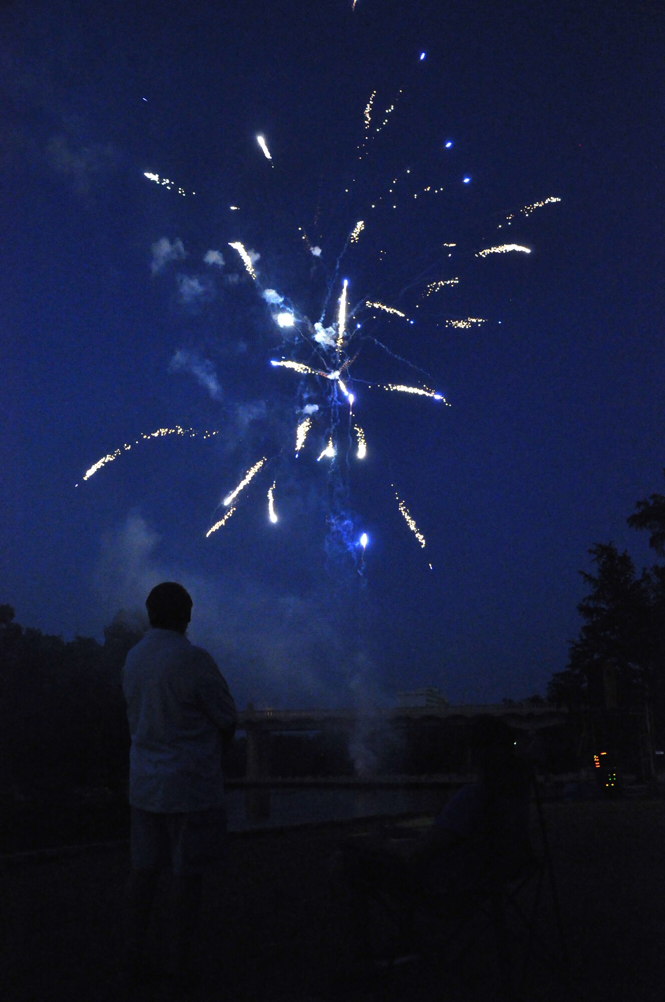 SAN ANGELO, Texas – Rich Berobles and Colton Herzing, spectators of the annual July 3rd Pops Concert, watch fireworks during the concert at the Bill Aylor Sr. Memorial River Stage . The Pops Concert featured fireworks for seven songs and a grand finale during “The Stars and Stripes Forever.” (U.S. Air Force photo/ Airman 1st Class Joshua Edwards)