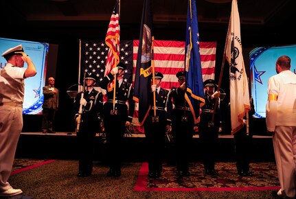 Members of the Joint Base Charleston Honor Guard present the colors during the Salute to the Military ceremony June 27, 2013, at the North Charleston Performing Arts Center, North Charleston, S.C. The Charleston Metro Chamber of Commerce presented awards to military members who volunteered a significant amount of their time in the community. The awards included the Enlisted Active-Duty Service Person of the Year, Enlisted Reservist of the Year and the Civilian Employee of the Year. (U.S. Air Force photo/Staff Sgt. Rasheen Douglas)