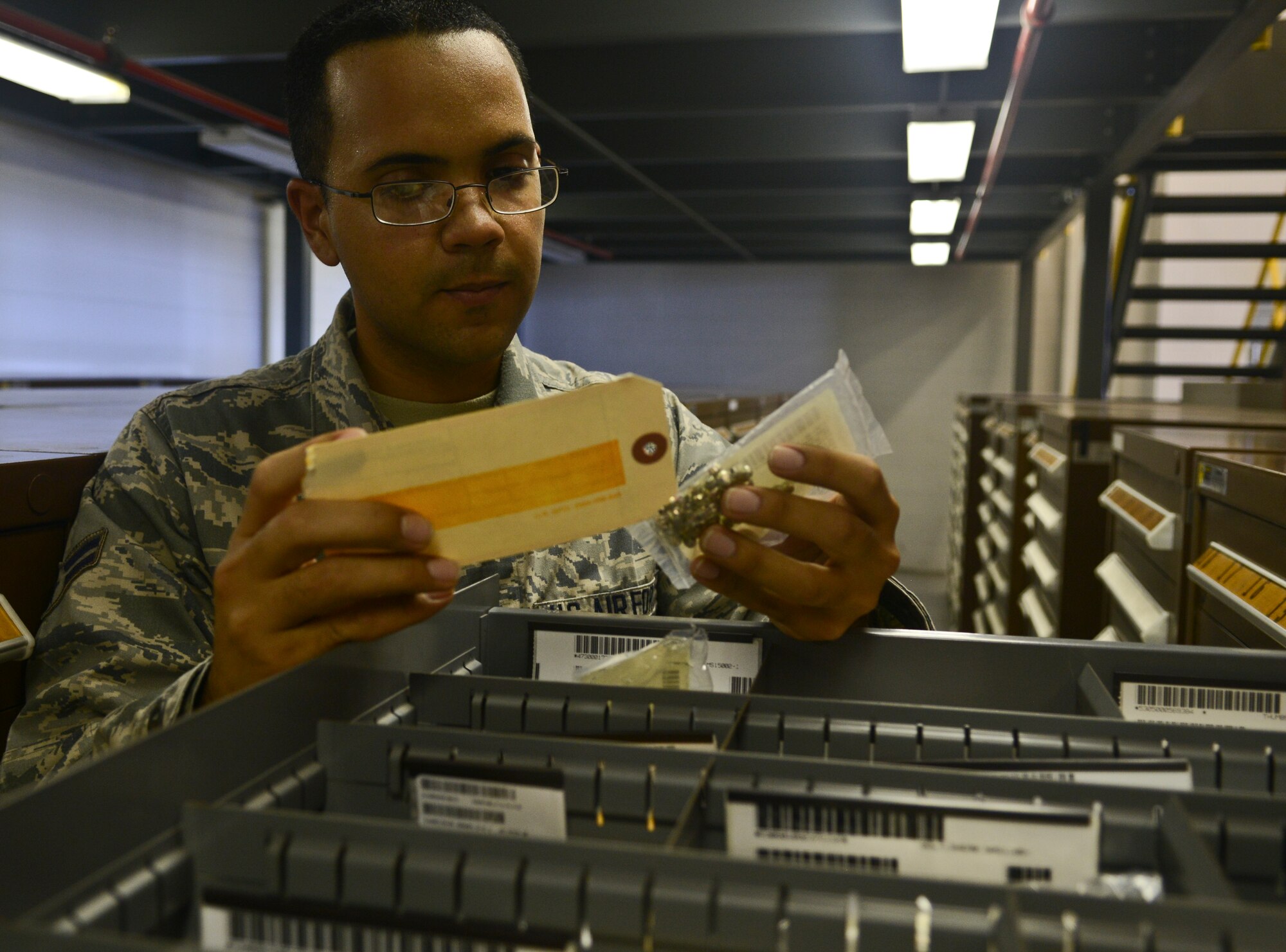 Airman 1st Class Luis Gonzalezvelez, 6th Logistics Readiness Squadron, performs an inventory check July 10, 2013, at MacDill Air Force Base, Fla. Members of the 6th LRS provide logistical support to sustain the worldwide mission of the 6th Air Mobility Wing, two war-fighting commands and 51 mission partners. (U.S. Air Force photo by Staff Sgt. Brandon Shapiro/Released)