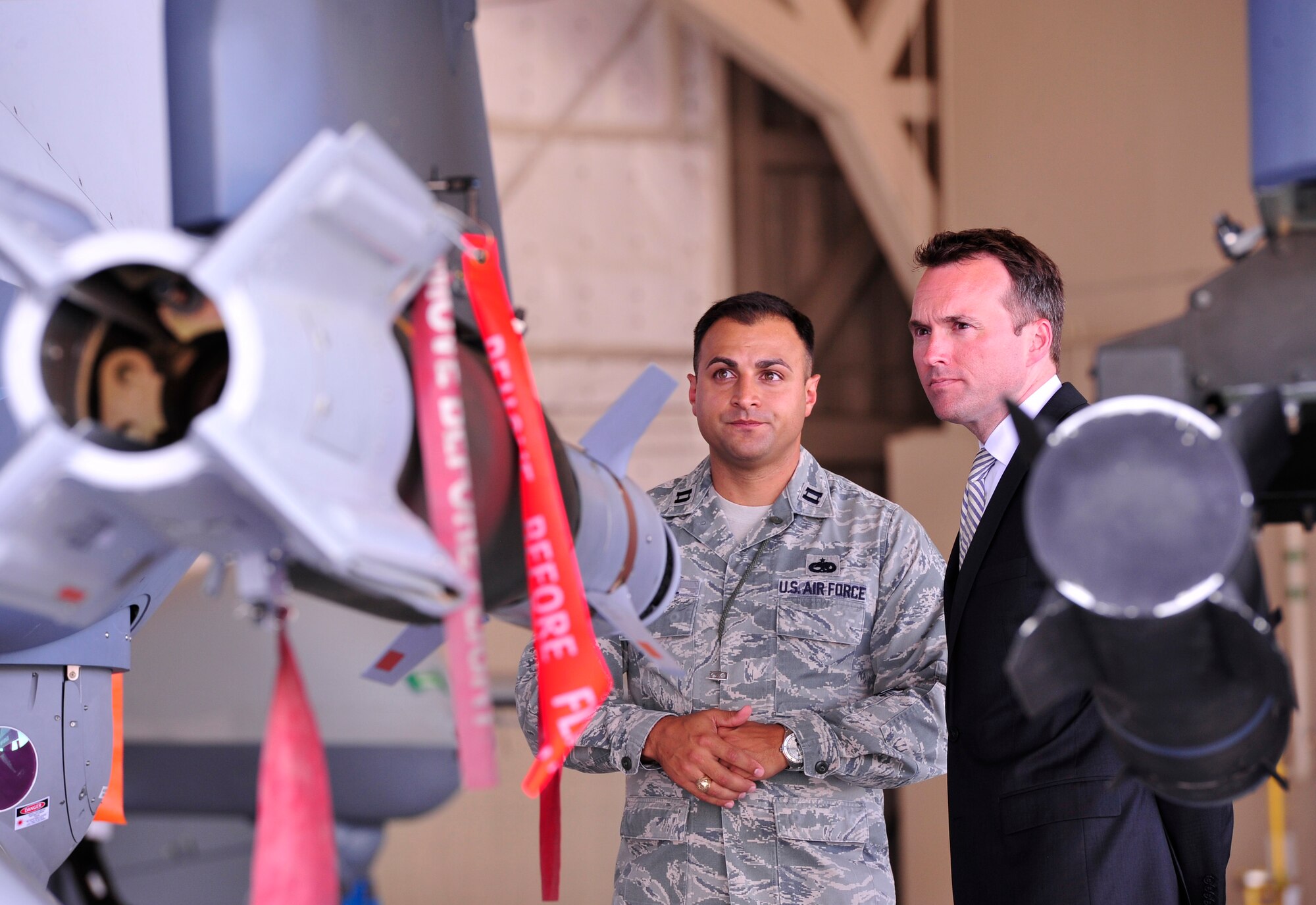 LAS VEGAS, Nev. -- Acting Secretary of the Air Force Eric Fanning receives a brief on the weapon capabilities of the MQ-9 Reaper aircraft from Capt. Joshua, 432nd Aircraft Maintenance Squadron, July 8, 2013. The MQ-9 Reaper has the ability to employ a range of weapon systems to include a precision laser-guided GBU-12 and highly accurate, low-collateral damage AGM-114 Hellfire missile. (U.S. Air Force photo by Staff Sgt. A.D./Released)