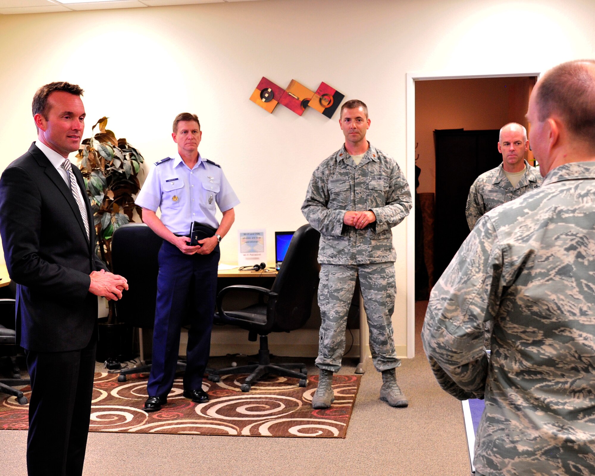 LAS VEGAS, Nev. -- Acting Secretary of the Air Force Eric Fanning, speaks to Chaplain (Capt.) Mark, 432nd Wing chaplain, during a visit to the Airman Ministry Center July 8, 2013. The Airman Ministry Center is a spiritual oasis that provides Creech Airmen a safe haven to decompress. (Photos have been edited for security purposes). (U.S. Air Force photo by Staff Sgt. A.D./Released)