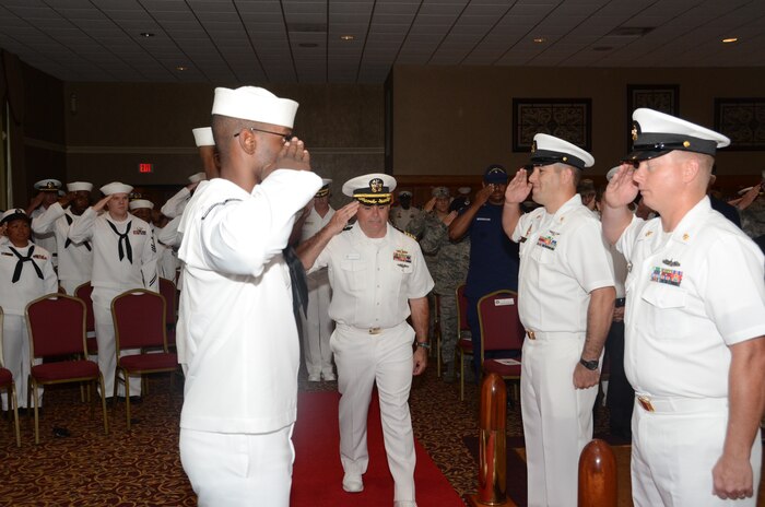 Navy Capt. Timothy Sparks is “piped aboard” to begin the Naval Support Activity change of command July 1, 2013, at the Redbank Club at Joint Base Charleston — Weapons Station. Sparks relieved Capt. Thomas Bailey. (U.S. Navy photo/ Petty Officer 1st Class Chad Hallford) 