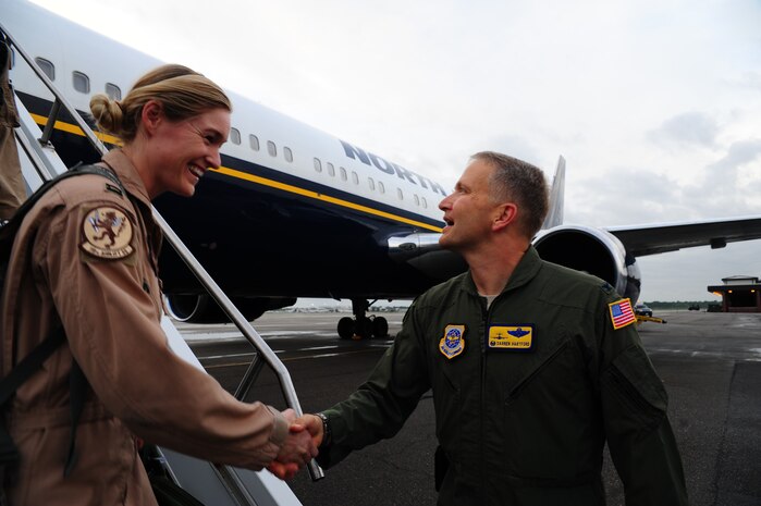 Col. Darren Hartford, 437th Airlift Wing commander, greets a returning member of the 16th Airlift Squadron during the 16th AS redeployment July 2, 2013, at Joint Base Charleston - Air Base, S.C. More than 120 Airmen from the 16th AS returned home from a 60-day deployment to Southwest Asia. Flying the C-17 Globemaster III, crews flew and supported roughly 1,000 sorties, logged more than 2,500 combat flying hours and airlifted more than 36 million pounds of cargo. (U.S. Air Force photo/ Airman 1st Class Chacarra Neal)