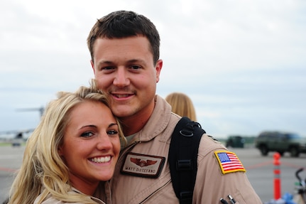 Capt. Matthew Distefano, 16th Airlift Squadron pilot, smiles as he reunites with his his wife  during the 437th Airlift Wing’s 16th AS redeployment July 2, 2013, at Joint Base Charleston - Air Base, S.C. More than 120 Airmen from the 16th AS returned home from a 60-day deployment to Southwest Asia. Flying the C-17 Globemaster III, crews flew and supported roughly 1,000 sorties, logged more than 2,500 combat flying hours and airlifted more than 36 million pounds of cargo. (U.S. Air Force photo/ Airman 1st Class Chacarra Neal)