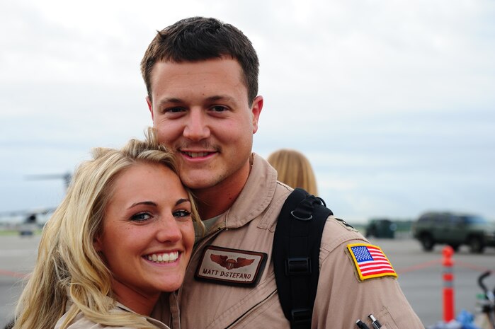 Capt. Matthew Distefano, 16th Airlift Squadron pilot, smiles as he reunites with his his wife  during the 437th Airlift Wing’s 16th AS redeployment July 2, 2013, at Joint Base Charleston - Air Base, S.C. More than 120 Airmen from the 16th AS returned home from a 60-day deployment to Southwest Asia. Flying the C-17 Globemaster III, crews flew and supported roughly 1,000 sorties, logged more than 2,500 combat flying hours and airlifted more than 36 million pounds of cargo. (U.S. Air Force photo/ Airman 1st Class Chacarra Neal)