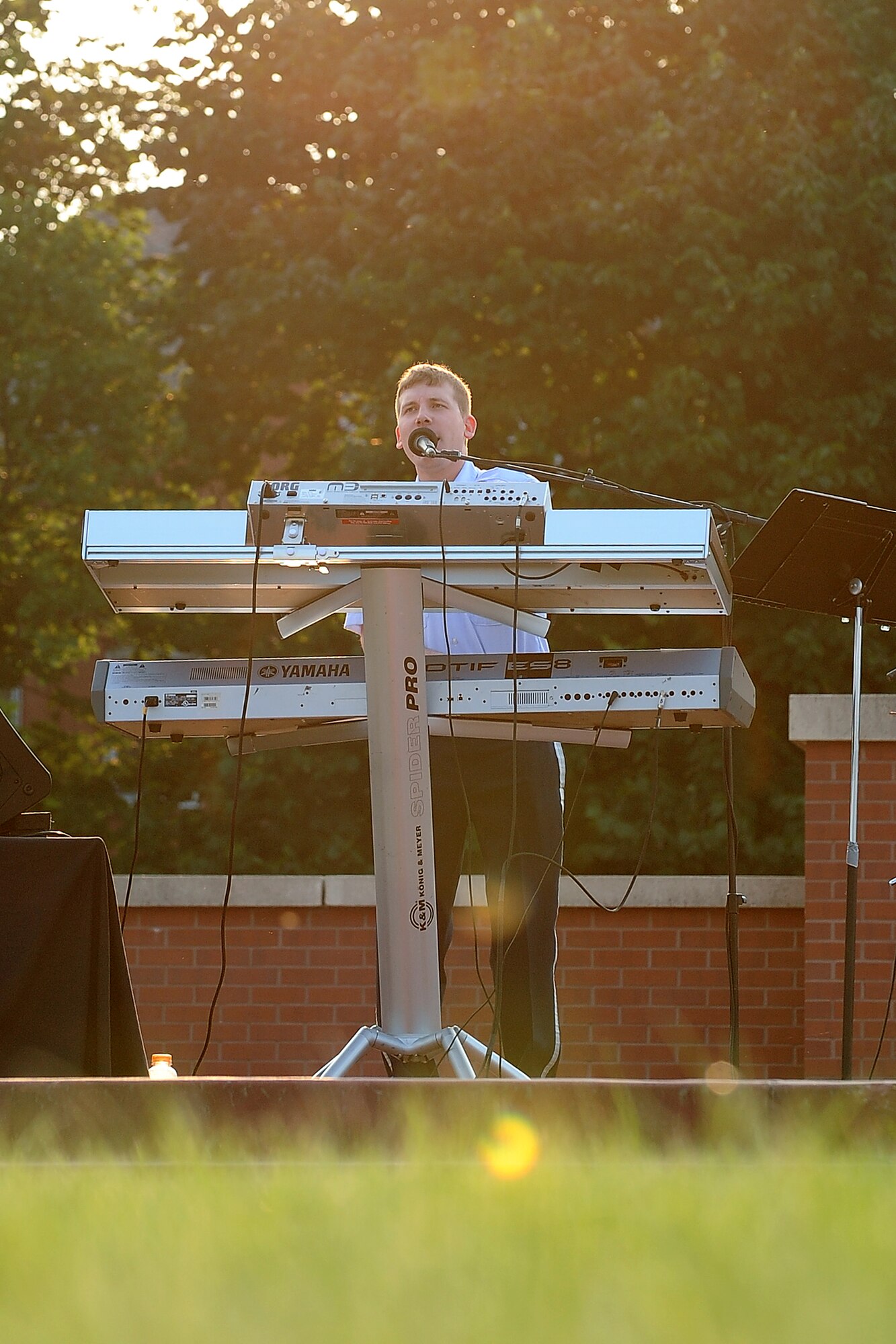 U.S. Air Force Airman 1st Class Adam Walker, a vocalist and keyboard player with the United States Air Force Heartland of America Band’s Raptor ensemble, performs on the Parade Grounds as part of the Sundays on Parade concert series on June 30, Offutt Air Force Base, Neb. Raptor performed for over an hour playing several hit songs to a crowd people. (U.S. Air Force photo by Josh Plueger/Released)